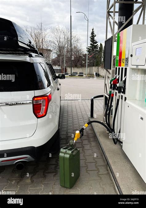 Volvo car at a petrol station being refueled