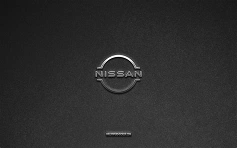 Logo Nissan con sfondo di automobili moderne