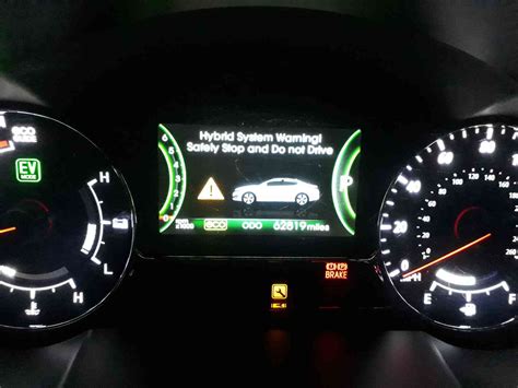 Toyota Prius dashboard with hybrid system warning light illuminated