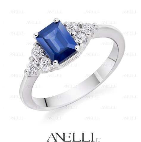 Anello trilogy con zaffiro centrale e diamanti laterali