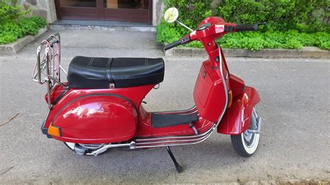 Vespa PX all'interno di un furgone Doblò