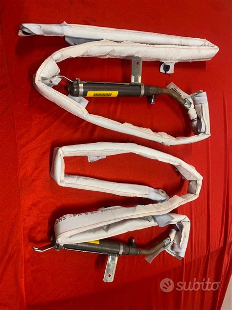 Airbag laterale a tendina esploso