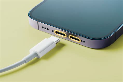 Close-up of a USB-C cable being plugged into a car's USB port