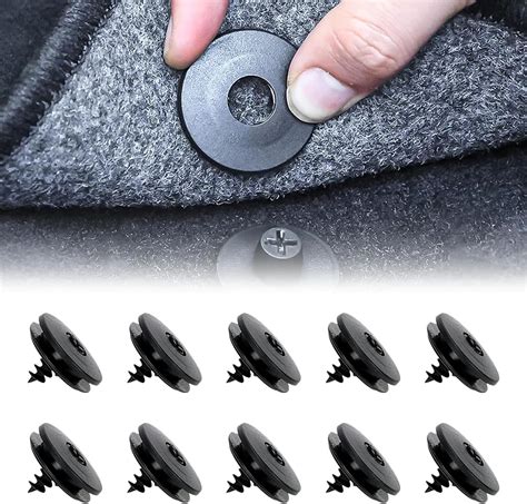 sistema di fissaggio tappetini auto