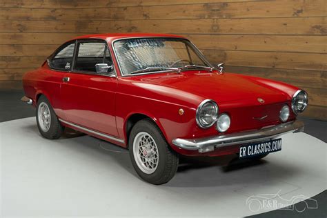 Esploso di una Fiat 850 Coupé con il parafango evidenziato