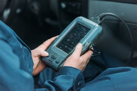 Automotive diagnostic tool connected to a car's OBD-II port