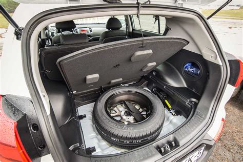 Spare tire (ruotino) in car trunk