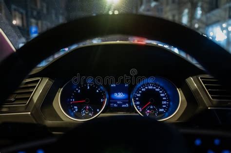 Close-up of a car's instrument cluster at night