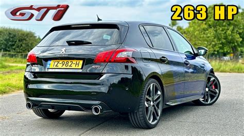 Peugeot 308 GTi in curva con le ruote anteriori che mostrano il grip
