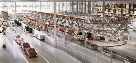 Vista panoramica di una fabbrica automobilistica con robot e linee di assemblaggio
