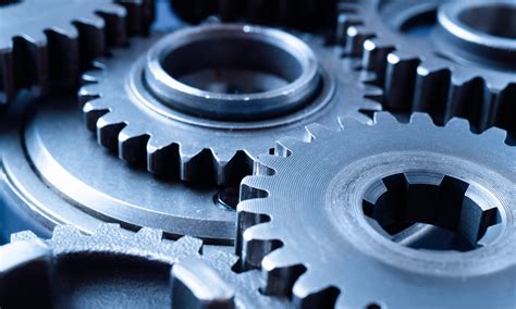 Rappresentazione di ingranaggi in movimento con indicazione di rumore
