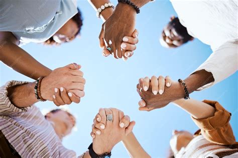 Crowd of people holding hands