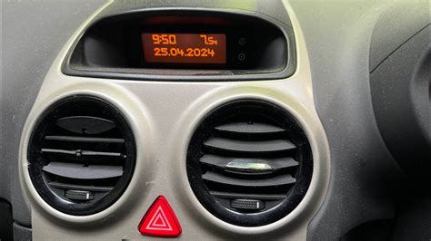 Close-up of an Opel Corsa clock showing incorrect time