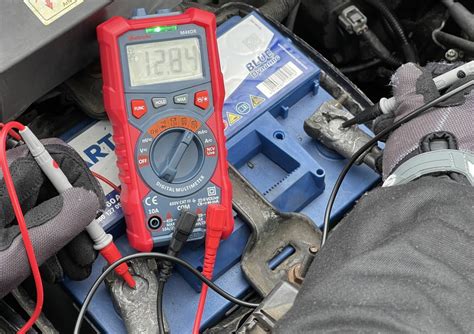 Car battery voltage check with multimeter