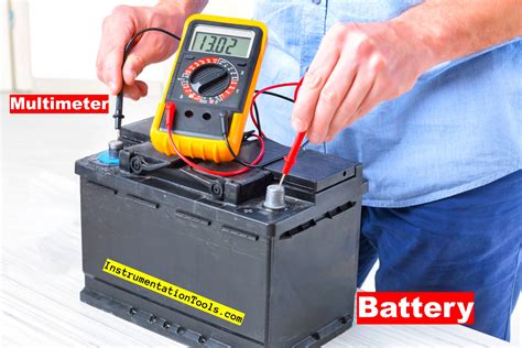 Voltmeter connected to car battery showing voltage