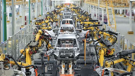 Render di un impianto di produzione di auto elettriche futuristico