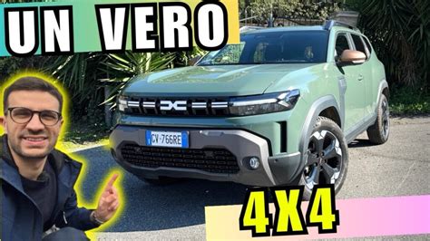 Dacia Duster 4x4 in salita su strada innevata