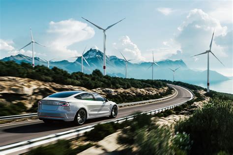 Auto elettrica in un paesaggio estivo