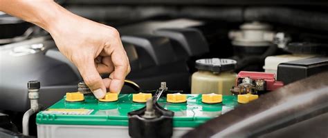 Lexus technician checking car battery