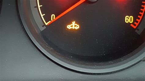 Opel Zafira dashboard with yellow spanner warning light