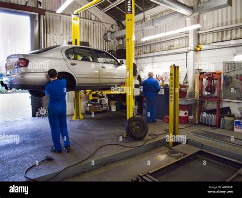Mechanics working in a car workshop