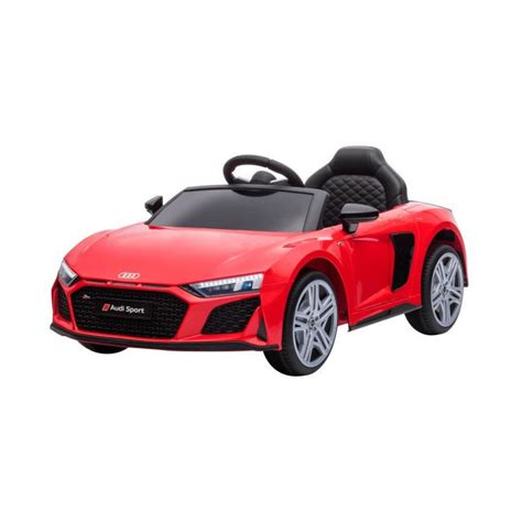 Bambino che guida un'auto elettrica rossa con schermo