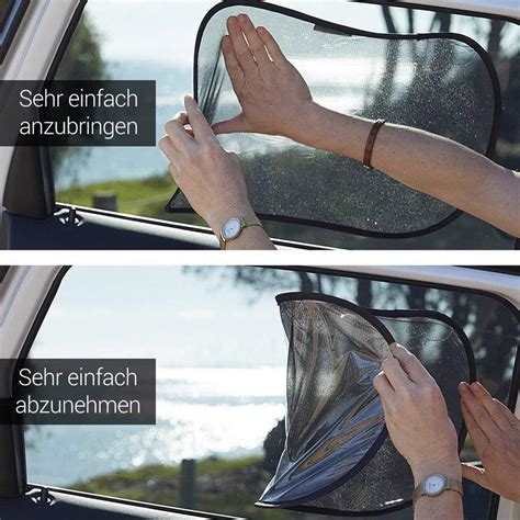 Persona che pulisce le tendine parasole di un'auto