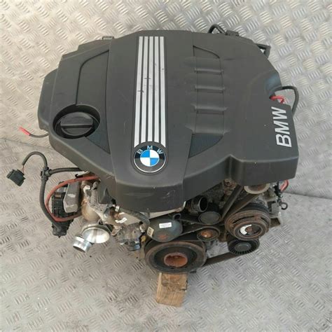 Motore BMW 118d con componenti evidenziati