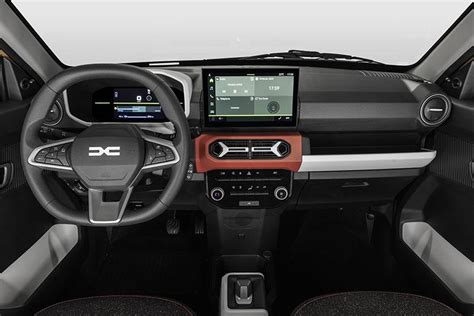 Interni Dacia Spring con dettagli colorati e vani portaoggetti