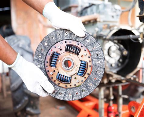 Workshop mechanic working on clutch
