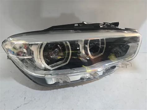 Faro BMW Serie 1 con lampadina allo xeno accesa