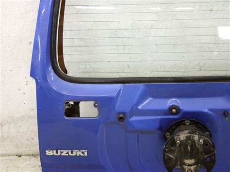 Suzuki Jimny 2008 vista posteriore con ruota di scorta