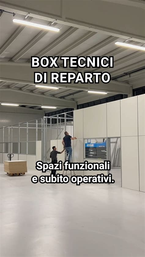 Interno di un'officina Volvo con tecnici al lavoro